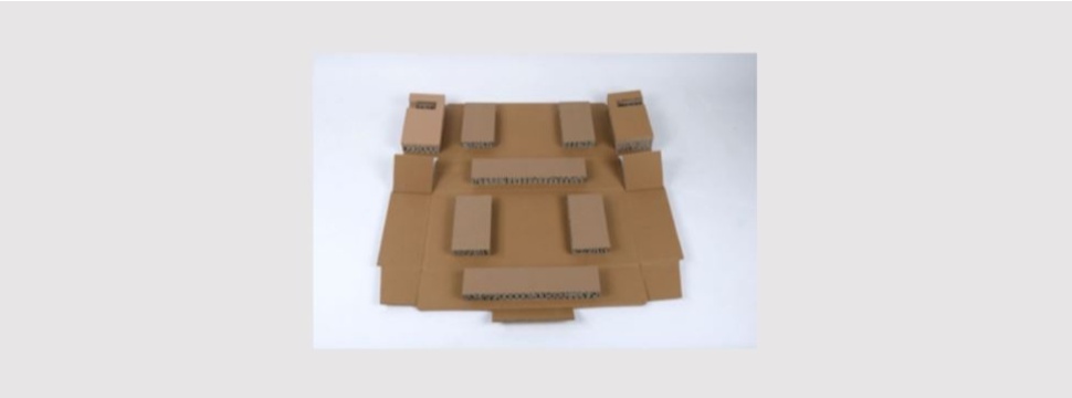 Corrugated cardboard folding box with glued-on cardboard pads