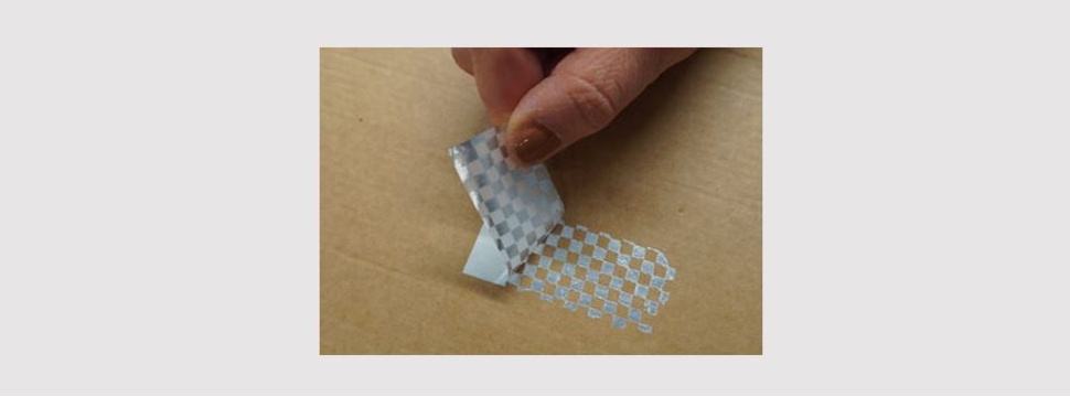 HERMA has now introduced HERMAvoid checkerboard (type 935), a tamper-proof self-adhesive material specially designed for challenging applications on rough (transport) cardboard