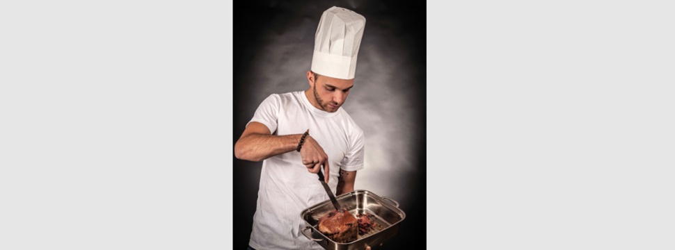 Cook with chef's hat made of paper