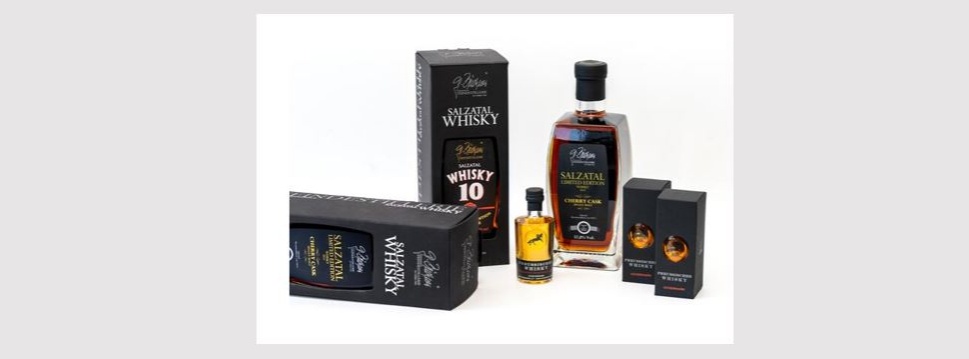 Black recycled paper packaging for “Preussischer Whisky” and “Salzatal Whisky”